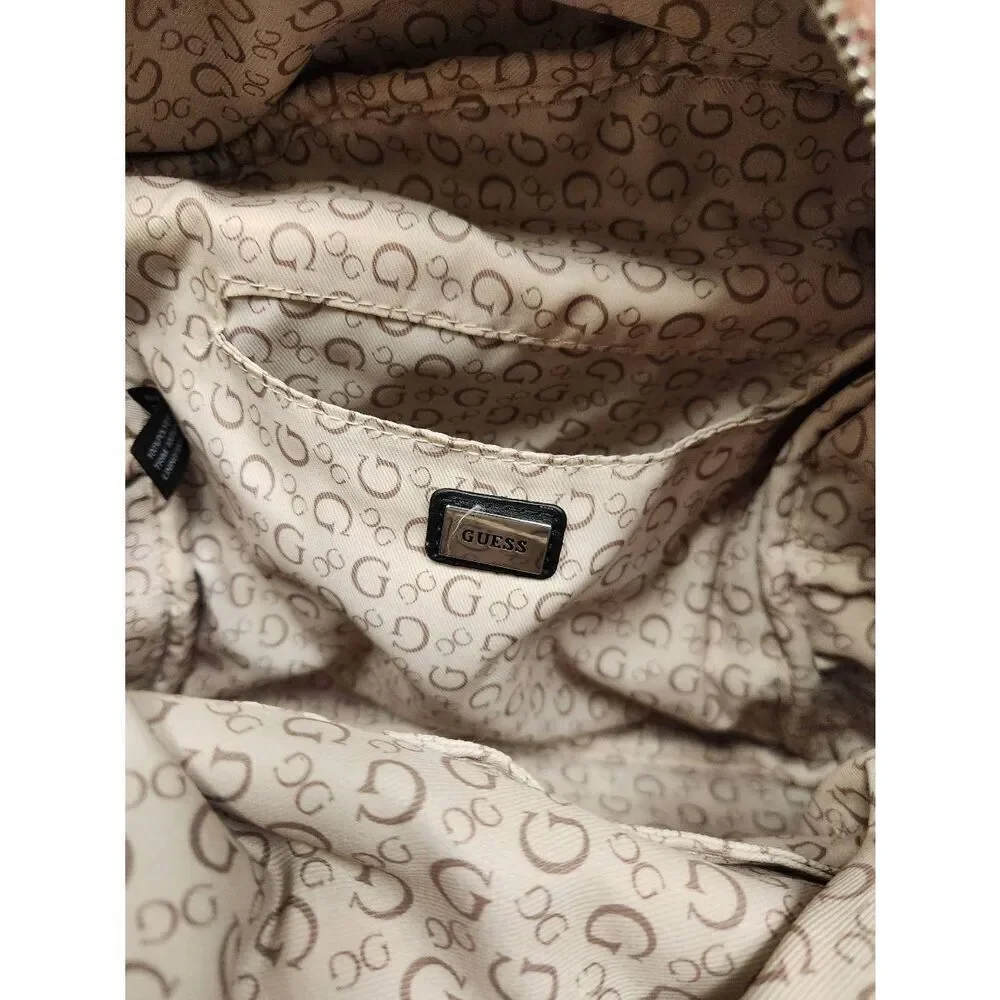 Guess small velvet feel pink backpack with black straps and pom. Measures approx